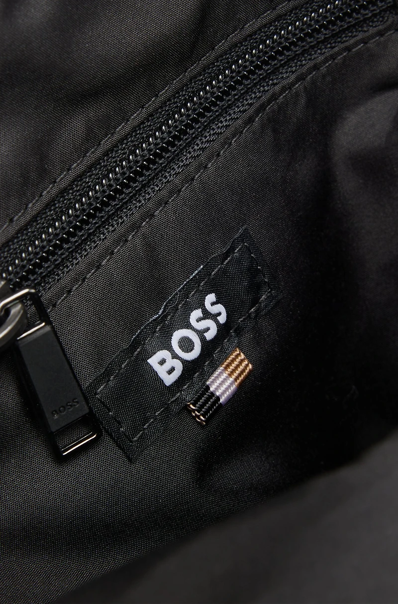 Crossbody bag with contrast logo and signature-stripe strap