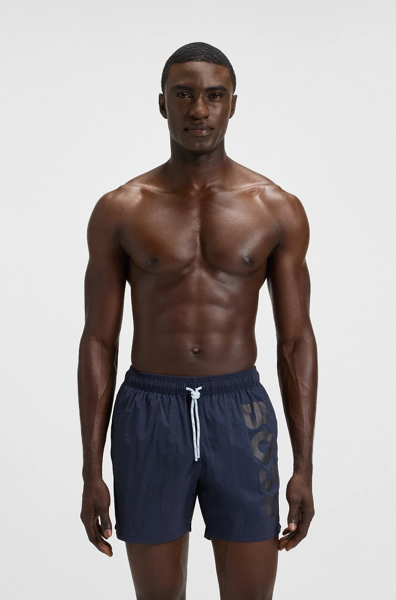 Swim shorts with vertical logo print