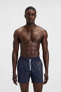 Swim shorts with vertical logo print
