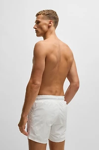Fully lined swim shorts with logo print