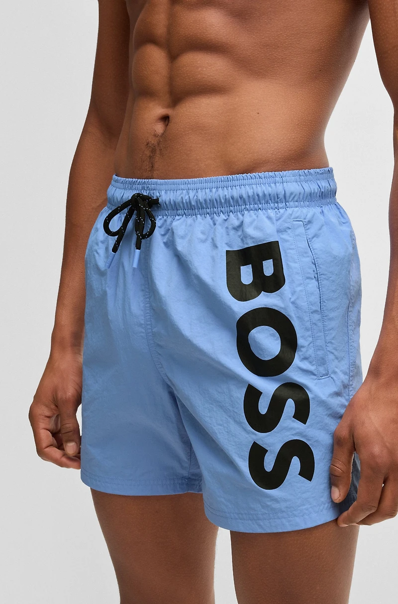 Fully lined swim shorts with logo print