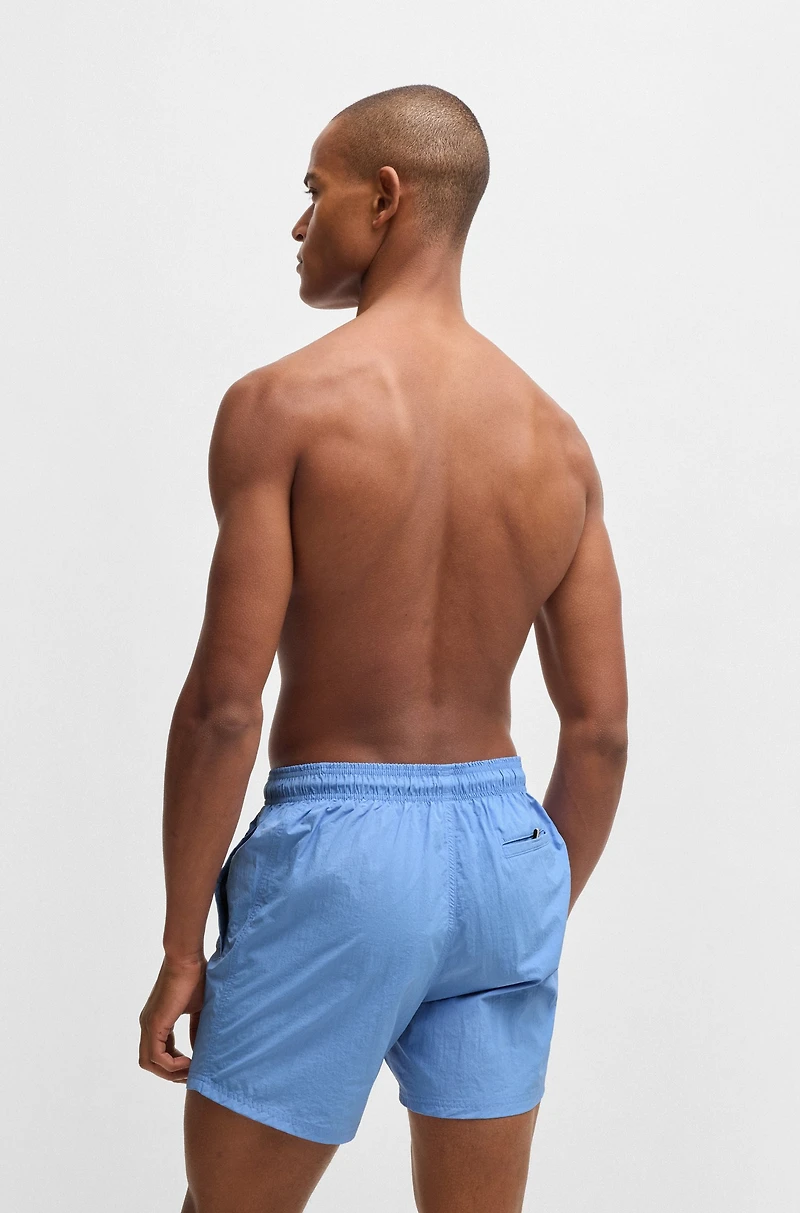Fully lined swim shorts with logo print