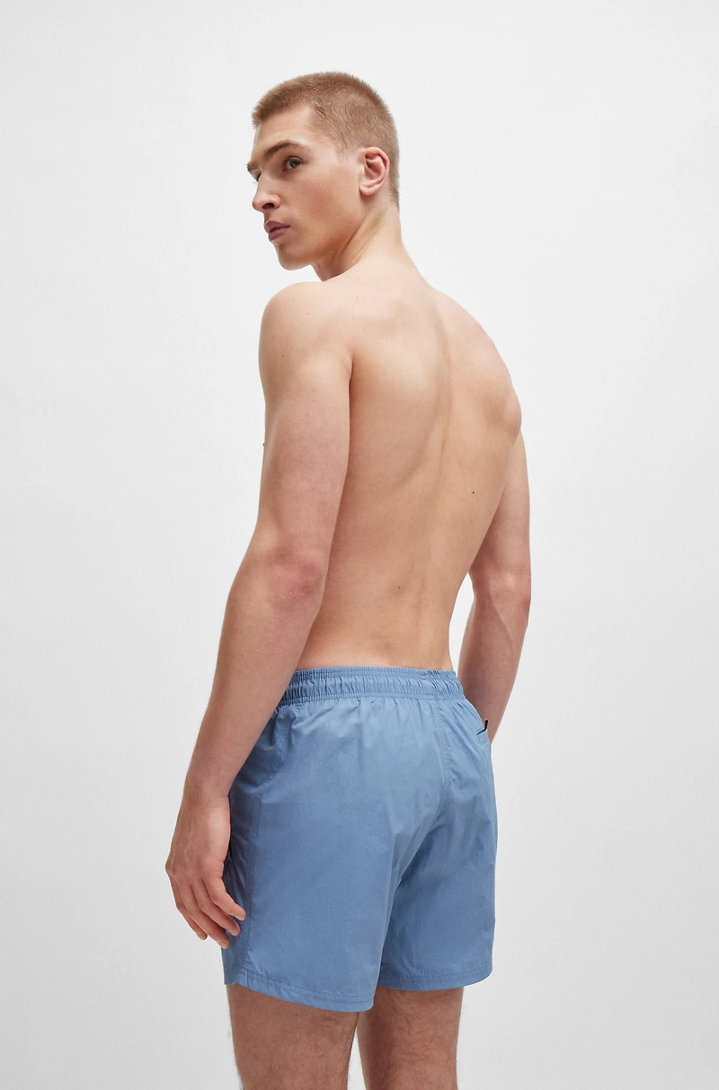 Fully lined swim shorts with logo print