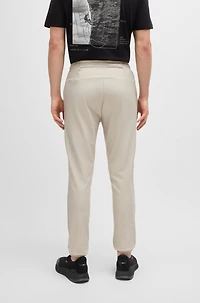 Tracksuit bottoms stretch fabric with decorative reflective logo