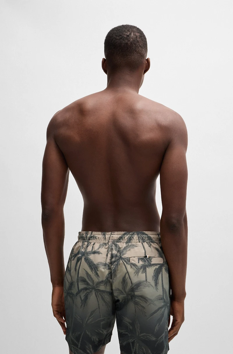 Quick-dry swim shorts with seasonal print