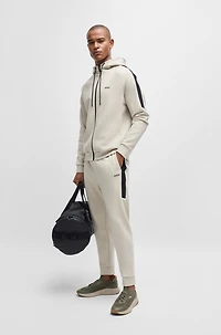 Mixed-material trainers with fishbone sole and signature accents