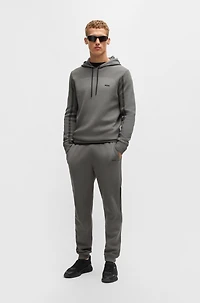 Regular-fit knitted tracksuit bottoms with stripes and branding