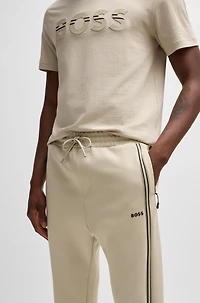 Tracksuit bottoms with tape inserts