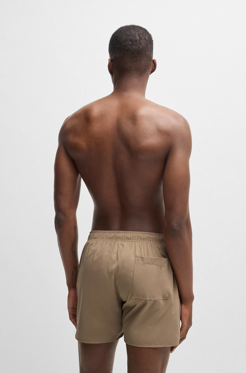 Fully lined swim shorts with signature stripe