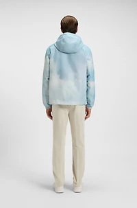 Water-repellent jacket with cloud artwork