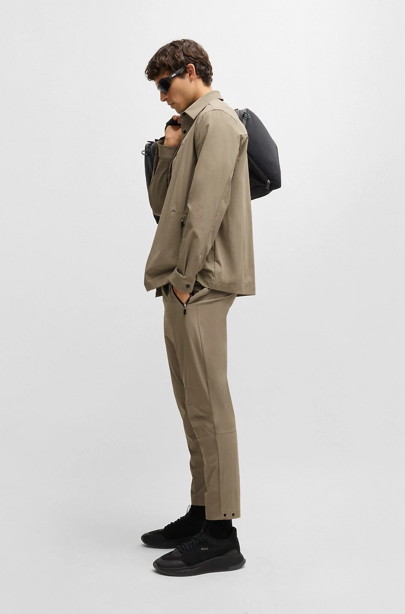 Tapered-leg trousers water-repellent stretch fabric