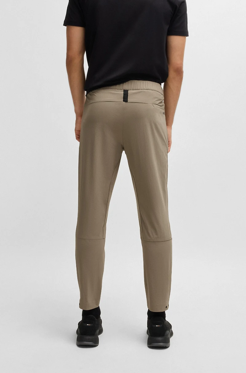 Tapered-leg trousers water-repellent stretch fabric