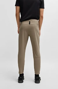 Tapered-leg trousers water-repellent stretch fabric