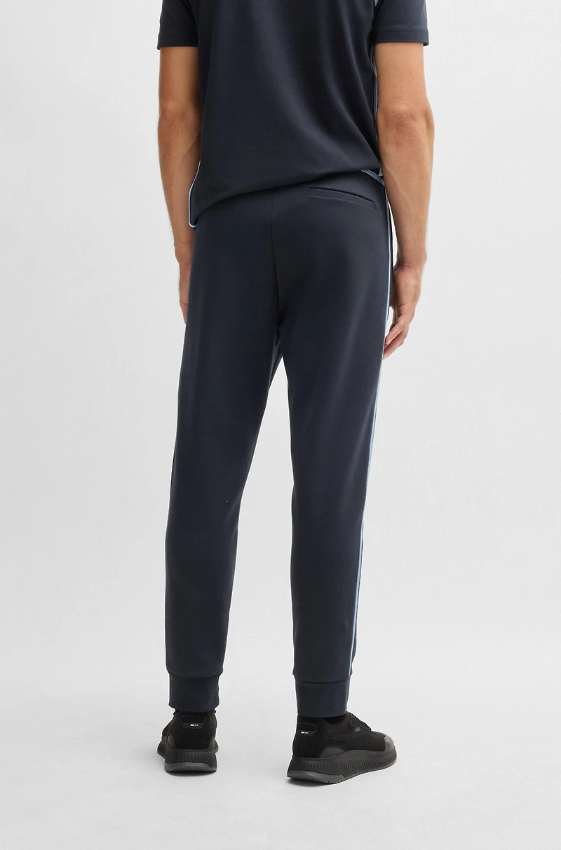Tracksuit bottoms with tape and logo