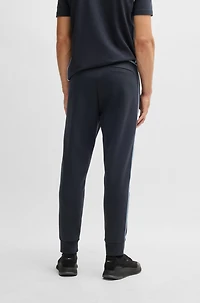 Tracksuit bottoms with tape and logo