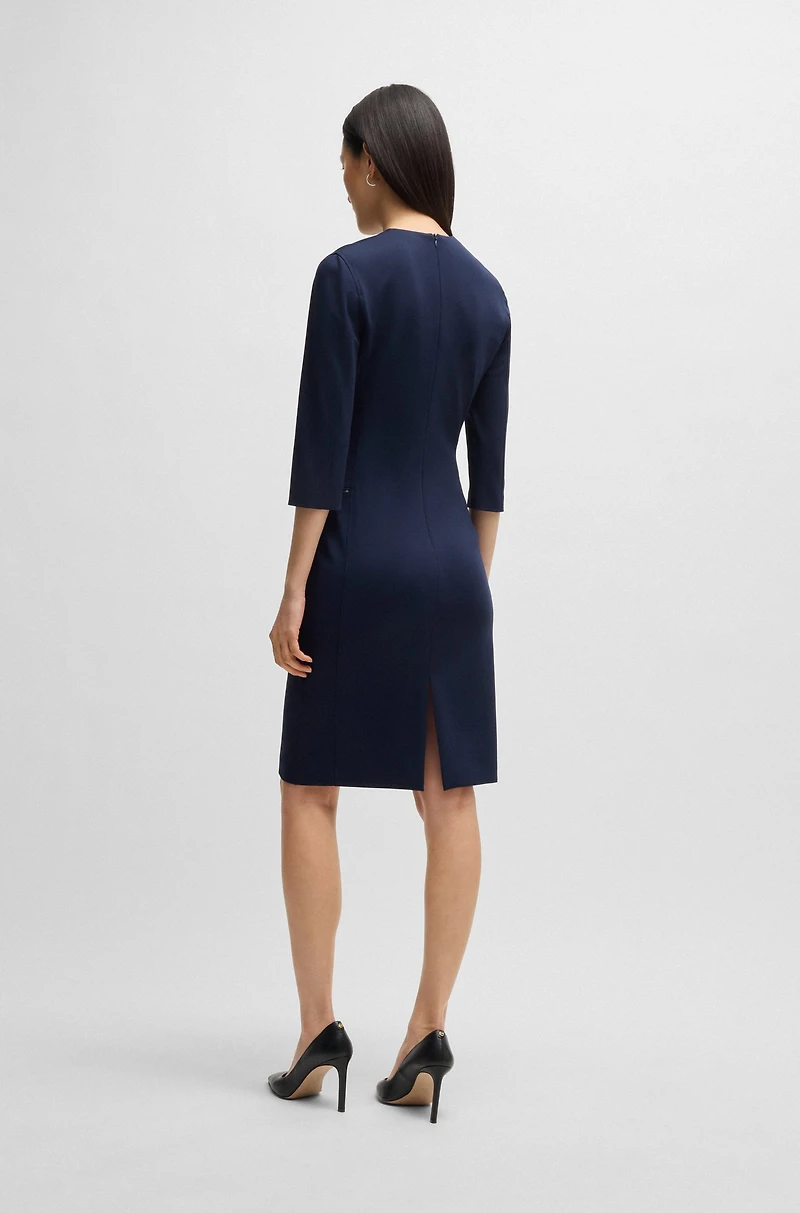 V-neck dress with zipped pockets and cropped sleeves