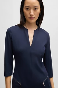 V-neck dress with zipped pockets and cropped sleeves