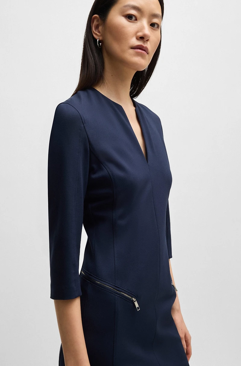 V-neck dress with zipped pockets and cropped sleeves