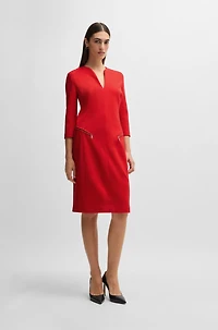 V-neck dress with zipped pockets and cropped sleeves