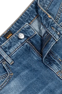 Knee-length denim shorts with raw hem