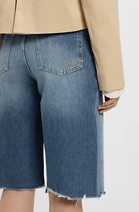 Knee-length denim shorts with raw hem
