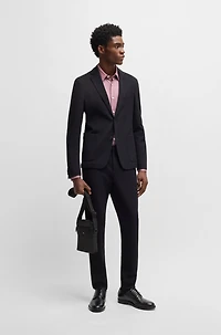 Structured reporter bag with signature trims