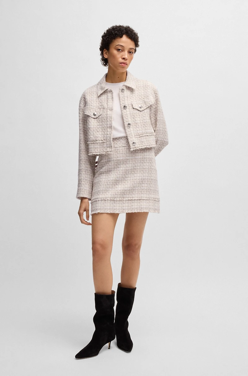 Cropped tweed jacket with metallic buttons
