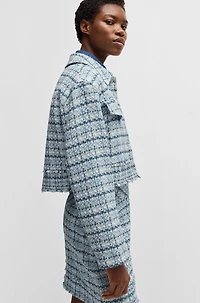 Cropped tweed jacket with metallic buttons