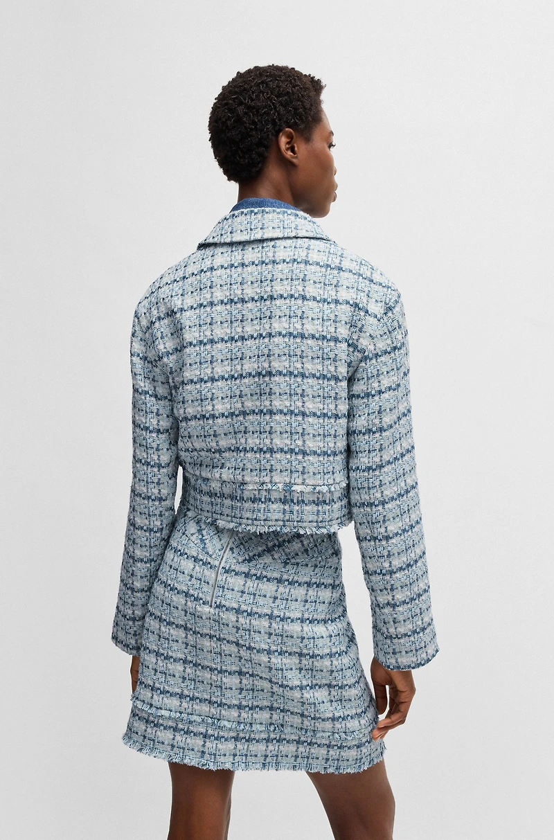 Cropped tweed jacket with metallic buttons