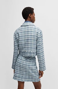 Cropped tweed jacket with metallic buttons