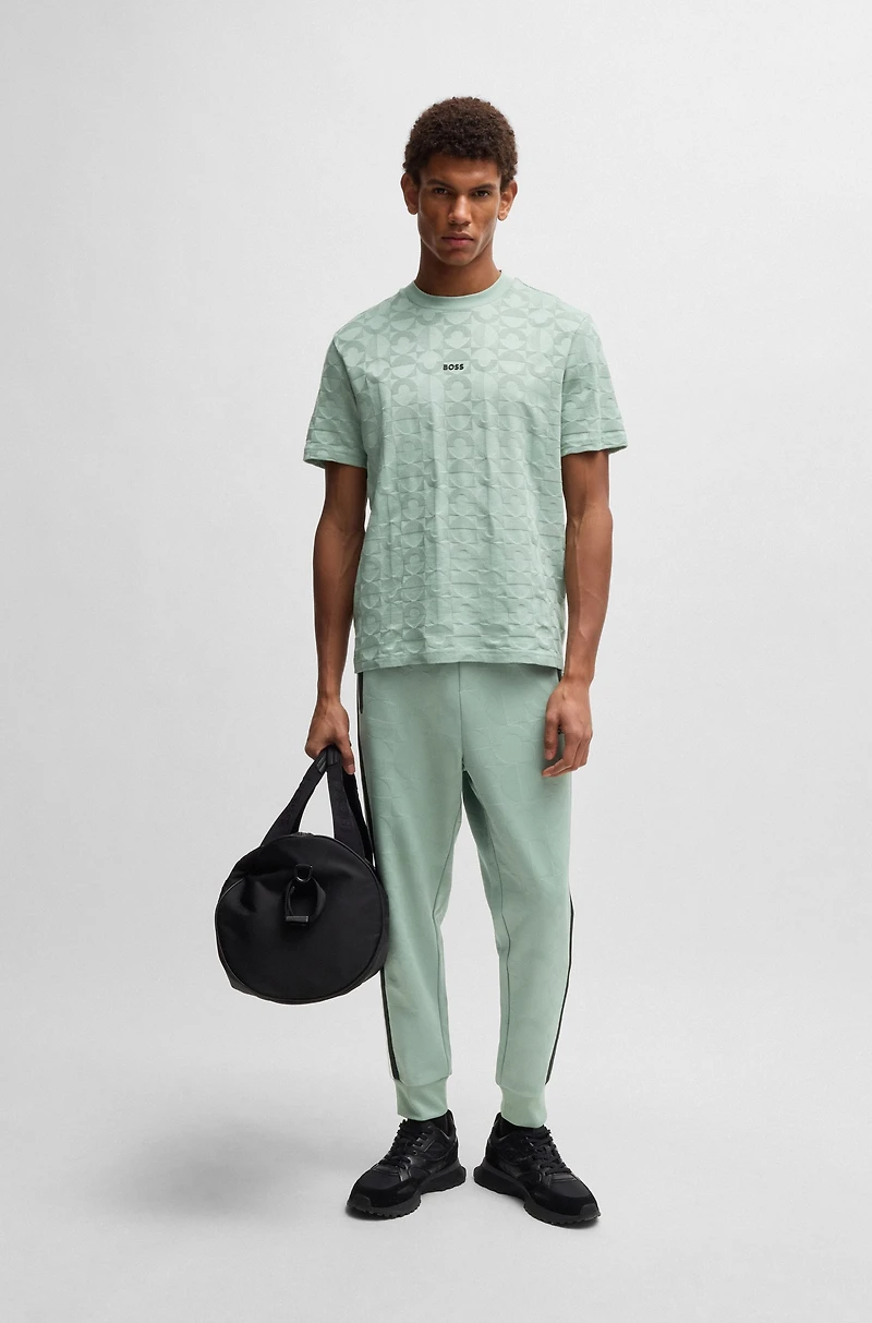 Relaxed-fit tracksuit bottoms with jacquard-woven circles