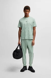 Relaxed-fit tracksuit bottoms with jacquard-woven circles