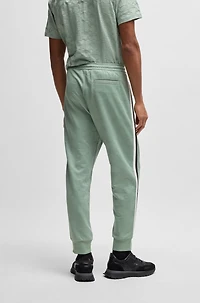 Relaxed-fit tracksuit bottoms with jacquard-woven circles
