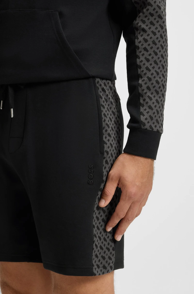 shorts with monogram-pattern panels