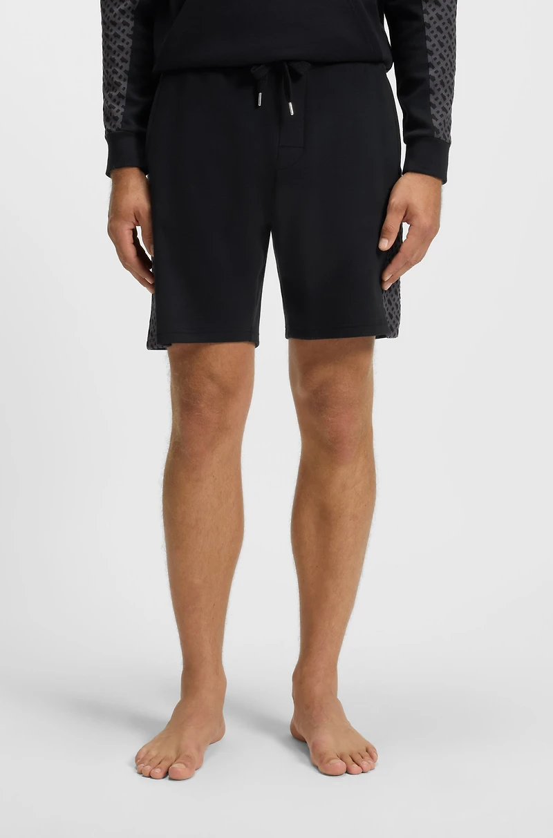 shorts with monogram-pattern panels