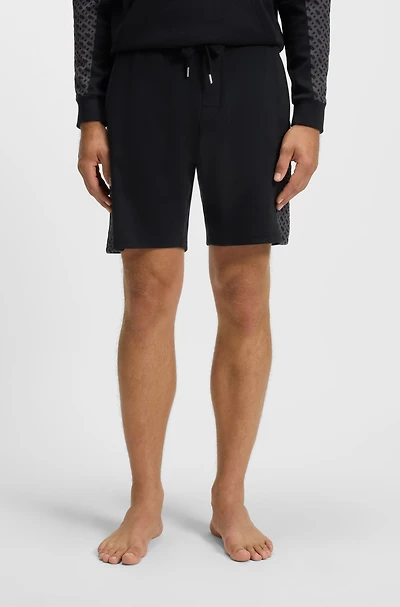 shorts with monogram-pattern panels