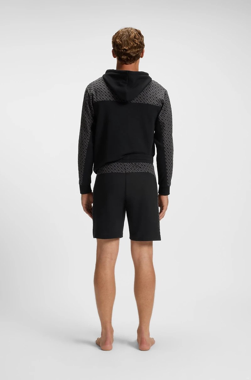 shorts with monogram-pattern panels