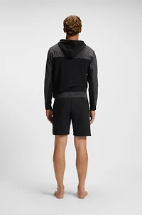 shorts with monogram-pattern panels