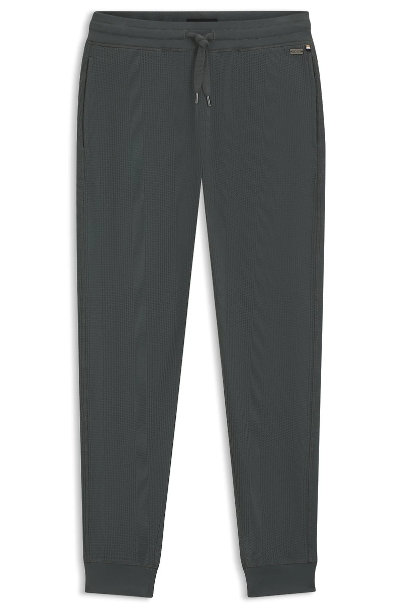 Waffle-structure tracksuit bottoms a cotton blend