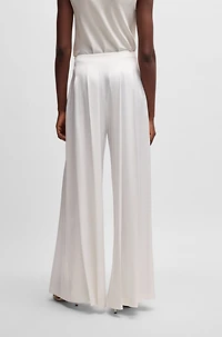 Relaxed-fit trousers with front pleats