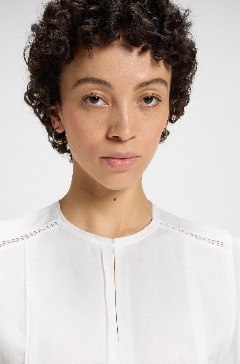 Frill-sleeve blouse with crochet-style trims