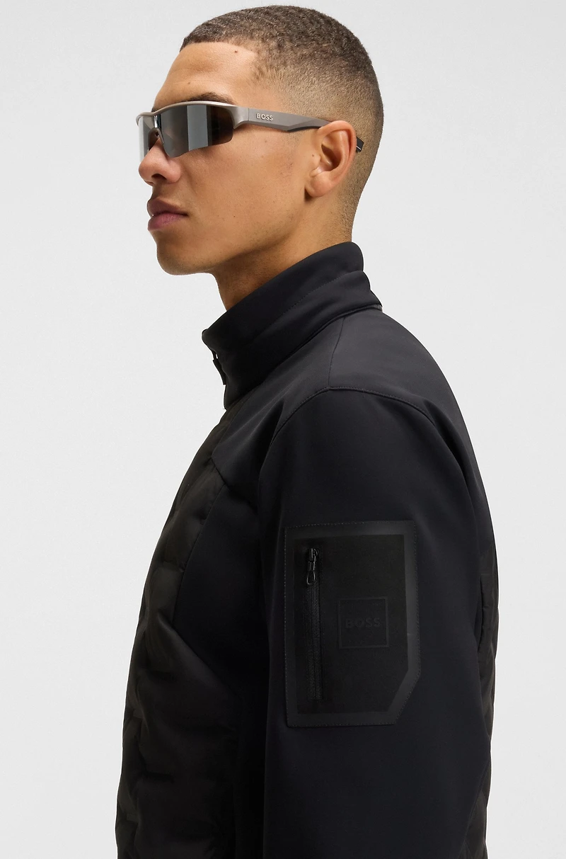 Down-filled jacket with welded logo pattern