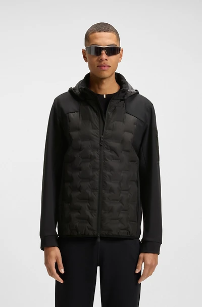 Down-filled jacket with welded logo pattern