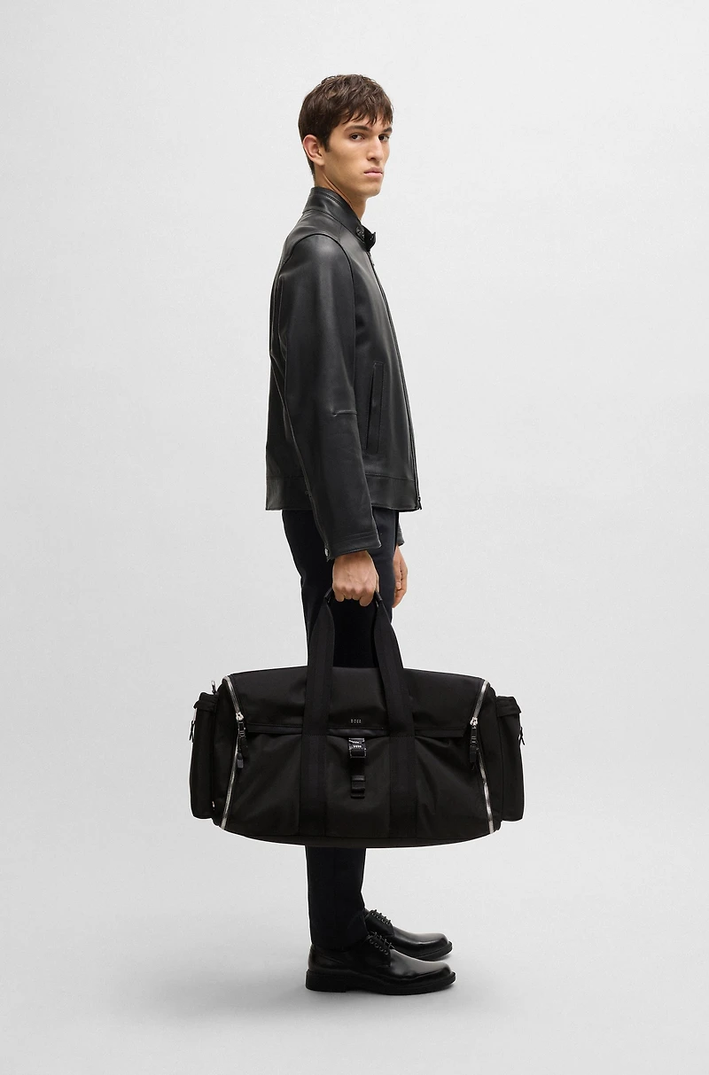 Holdall with zipped suit compartment