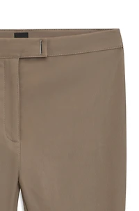 Leather leggings with logo-hook closure