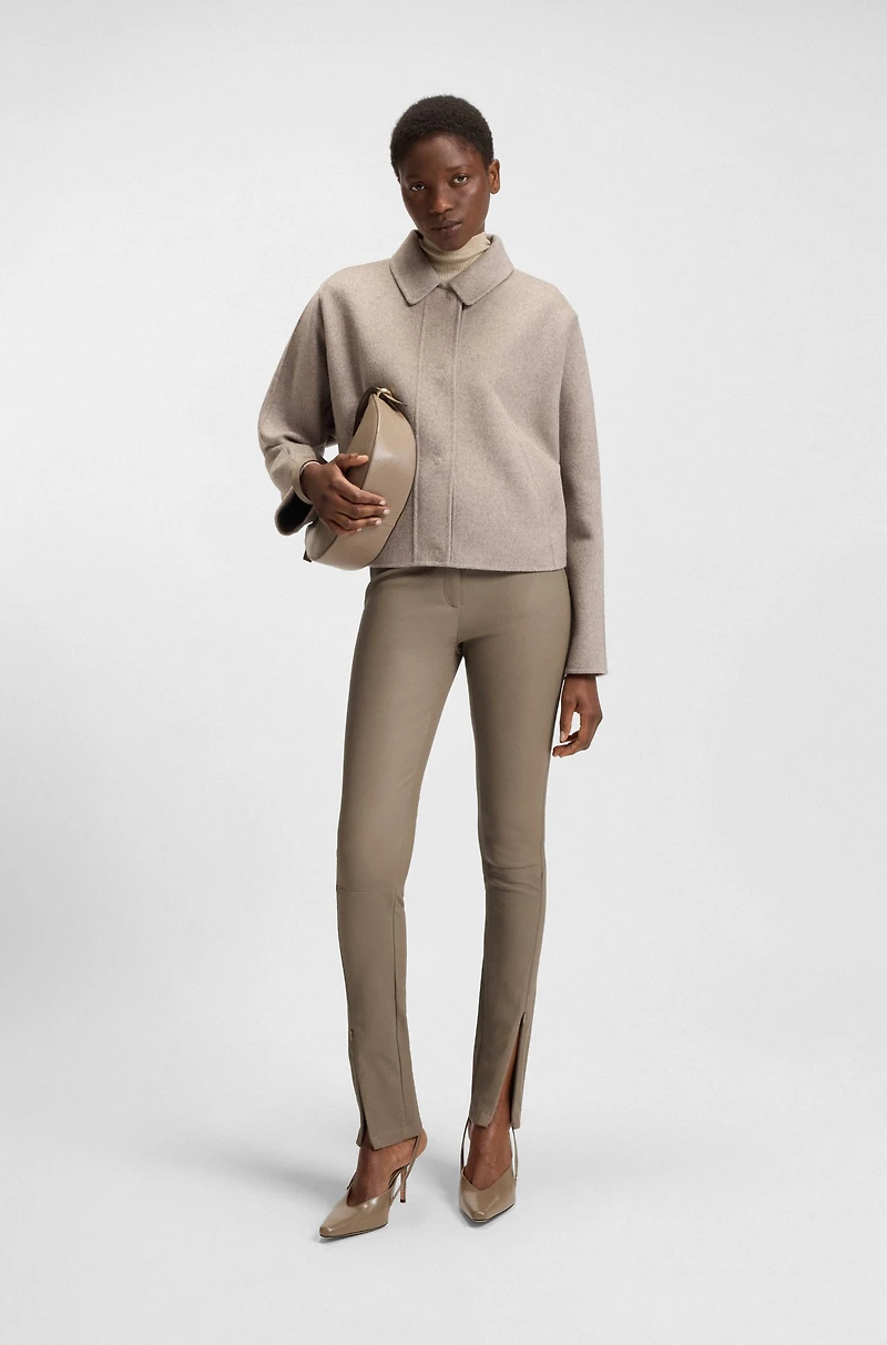 Leather leggings with logo-hook closure