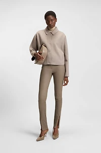 Leather leggings with logo-hook closure