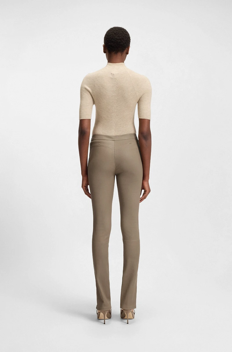 Leather leggings with logo-hook closure