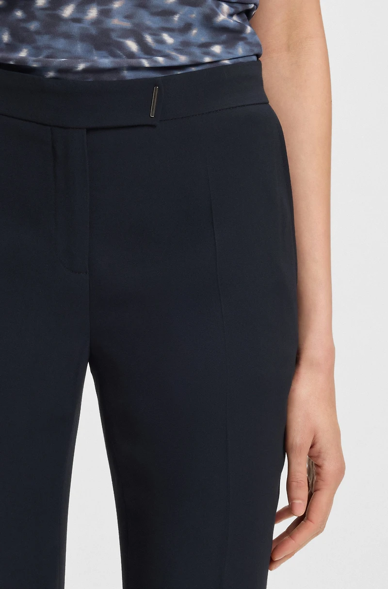 Slim-fit trousers with slit hems