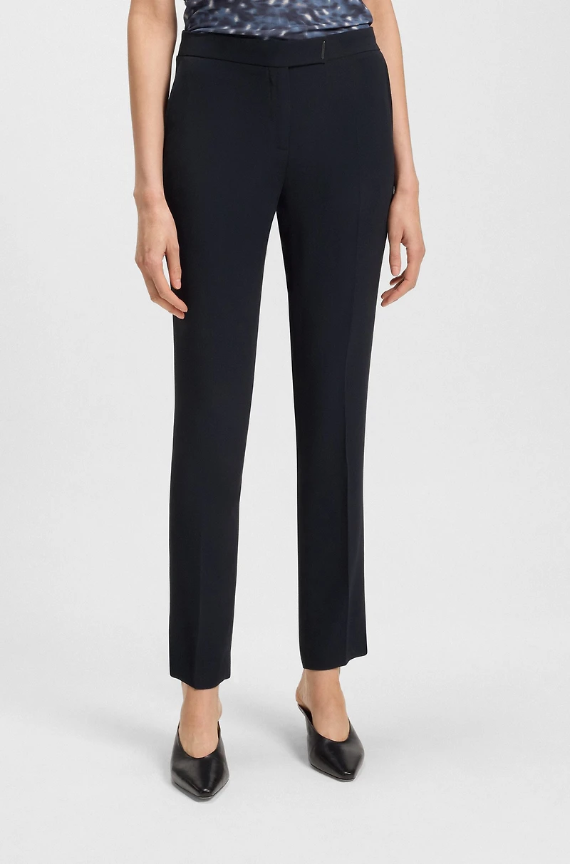 Slim-fit trousers with slit hems
